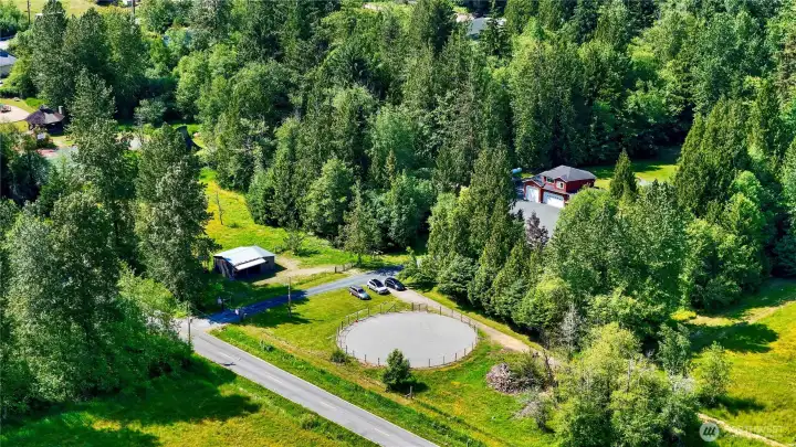 Round pen, horse barn, fields, forest, and the home itself
