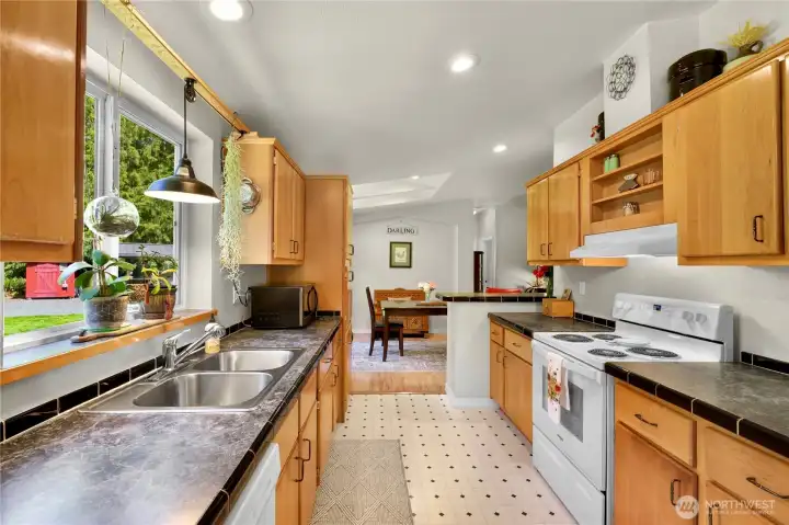 Lots of cabinets in the spacious kitchen