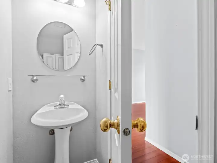 Rounding out the main floor is the 1/2 bath, conveniently located for both easy access and privacy. Rounding out the main floor is the 1/2 bath, conveniently located for both easy access and privacy.