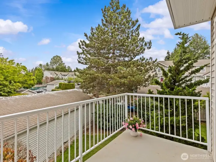 Enjoy the sun while relaxing. Landscaping and garages provide privacy from passersby. Enjoy the sun while relaxing. Landscaping and garages provide privacy from passersby.