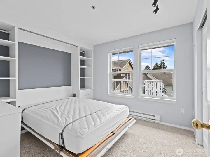 Here you'll find a murphy bed with built-ins so it can easily be used as a home office without sacrificing space for guests. Here you'll find a murphy bed with built-ins so it can easily be used as a home office without sacrificing space for guests.