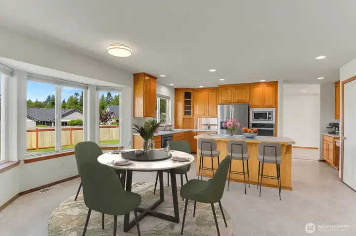 Eating Area with Bay Window Viewing into the Kitchen-Virtually Staged