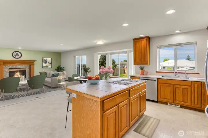 View from Kitchen Island to Family Room - Virtually Staged
