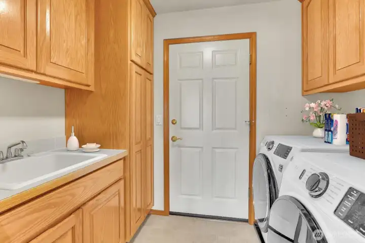 Laundry Room with Utility Sink & Lead to the Garage