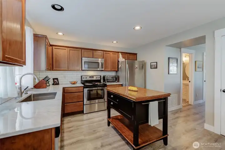 Marble counter tops, a peak toward the hall powder bath
