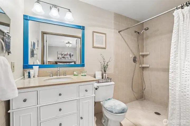 En-suite bathroom with curbless shower.