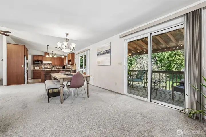 Dining area connects to porch with two sets of sliding glass doors.