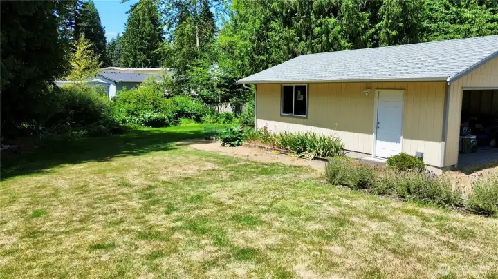 Backyard and large detached garage.