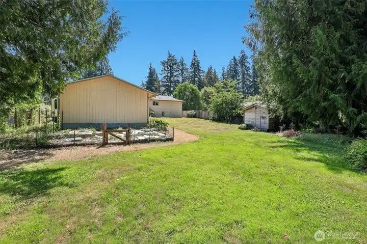 Backyard with fenced garden.