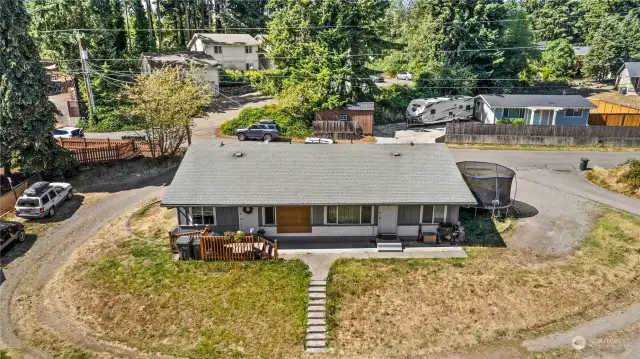 Another view of the wrap around driveway and huge back yard space!