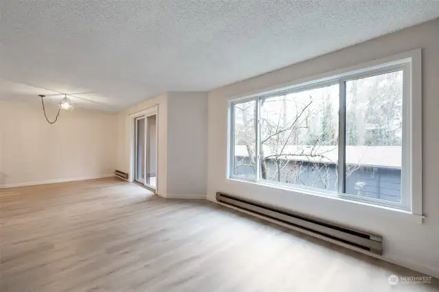 A large window floods this home with natural light and provides serene sounds and views of a burbling creek!