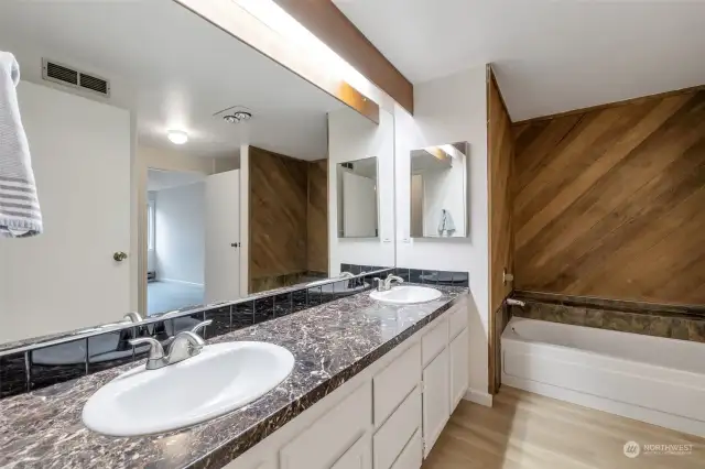 Dual-sink vanity and soaker tub make this bathroom a retreat after a long day!