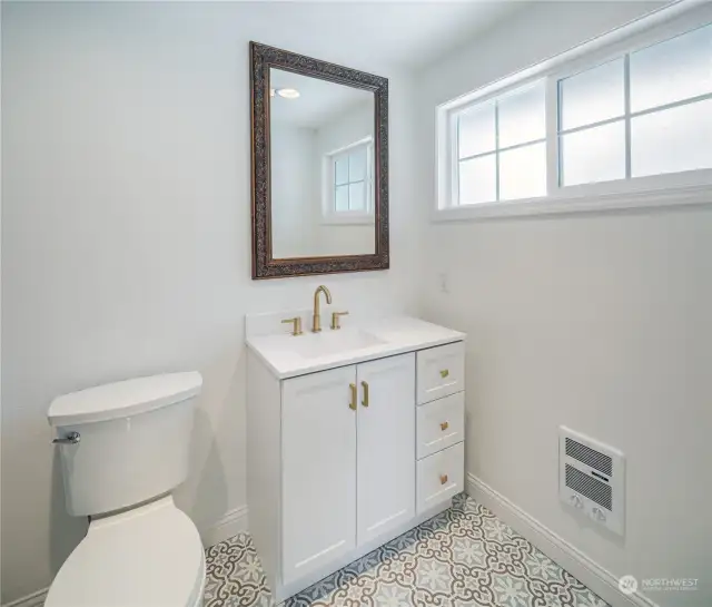 Primary bath with new tile flooring