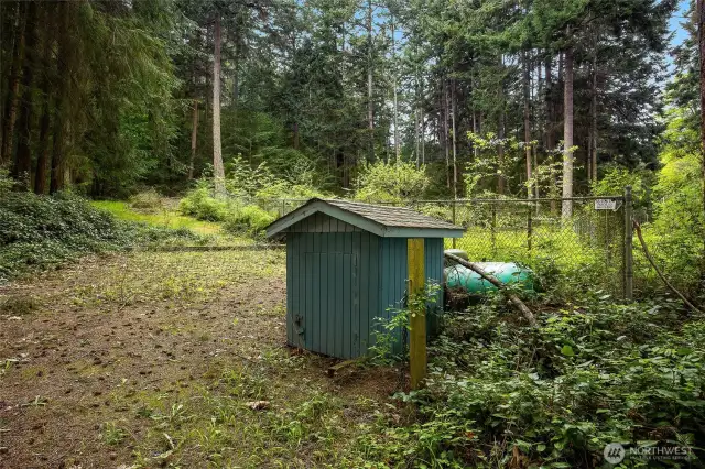 Additional 2.08 Acre lot across the street has private well, propane, fenced garden with fruit trees and RV parking