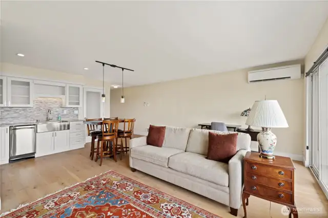 Warm and welcoming open living.  Door in center is stack washer and dryer.