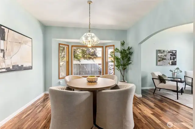 Dedicated dining room with new hardwood flooring with arched entry, vaulted ceilings and bay window, so much natural light. Newly painted. Owners have also opted to use this room for multiple purposes such as formal living, study/office, den, playroom, library, media room, game room, etc.