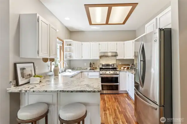 Beautiful, renovated and updated kitchen with new granite counters, cabinets and stainless steel appliances