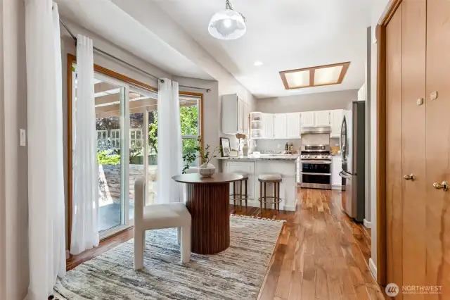 Breakfast nook leading to slider doors where you have a covered patio