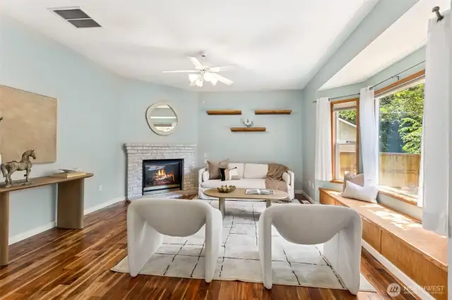 Living room with gas fireplace; large windows and window seat - again, so much natural light!!