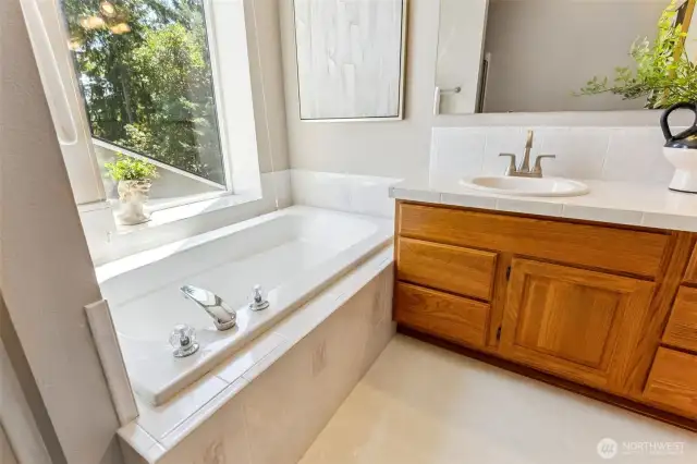 5-piece primary bath is like a spa retreat includes a soaking bathtub, standing shower, double sinks and toilet closet