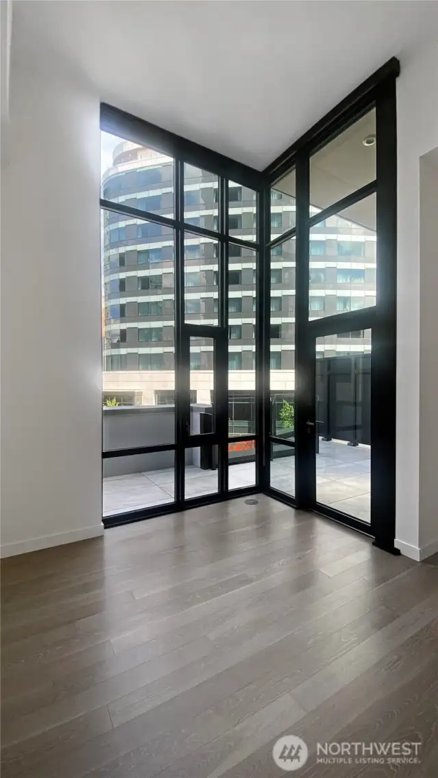 Corner of glass wall overlooking the large outdoor space.