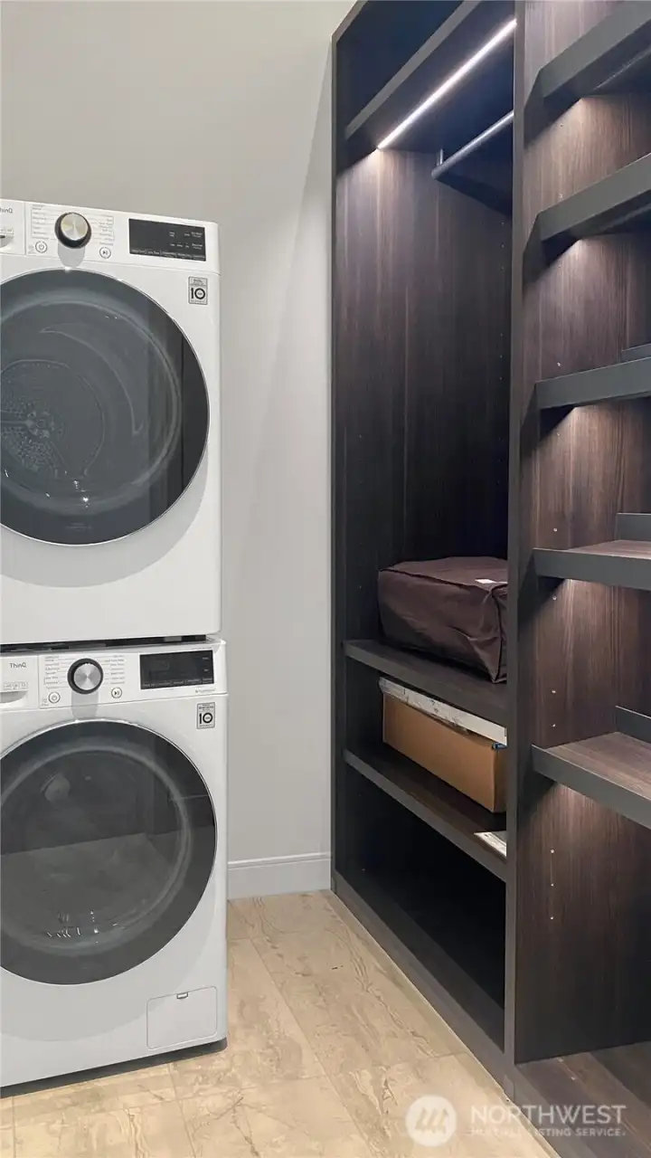 Laundry room with extensiuve built in storage sysytem.