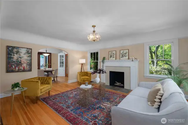 Fireplace that has been rebuilt. Original hardwood floors have been recently refinished.