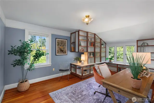 Fir floors in one of three bedrooms, as well as lovely built in shelves.
