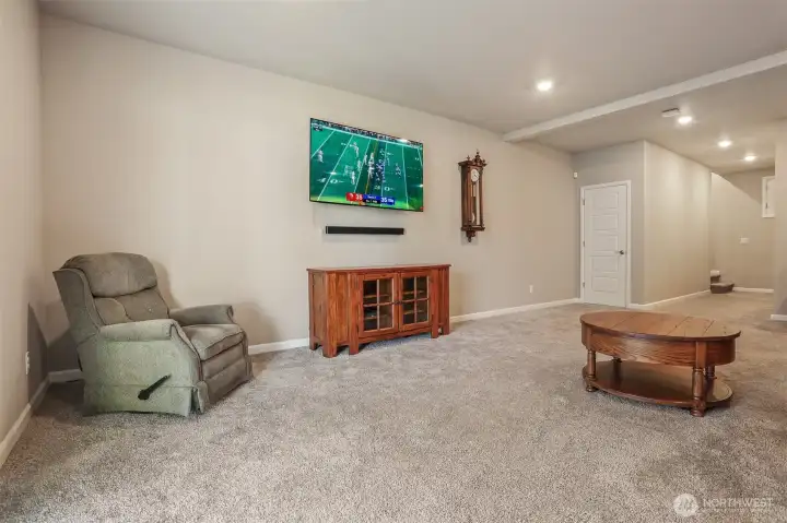 Daylight lower level family room with sliding door to covered heated patio and private fenced back yard.