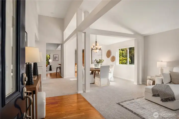 The formal entry opens up to soaring vaulted ceilings and an oak entryway.