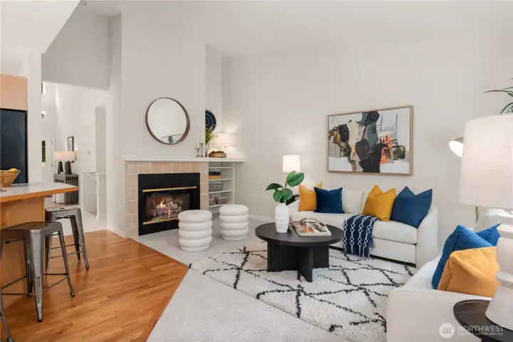 Just off the kitchen is this second lounge area. The family room features a gas fireplace, built-in shelving and vaulted ceilings.