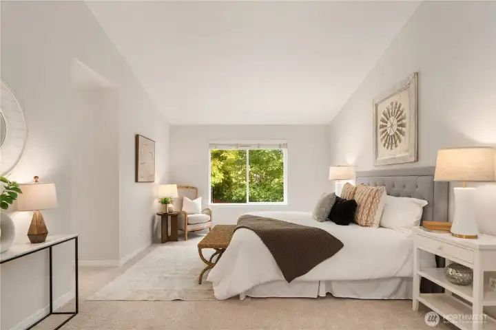 Double french doors open up to this massive primary suite with vaulted ceilings, new paint, new carpet and a spa-worthy en suite.