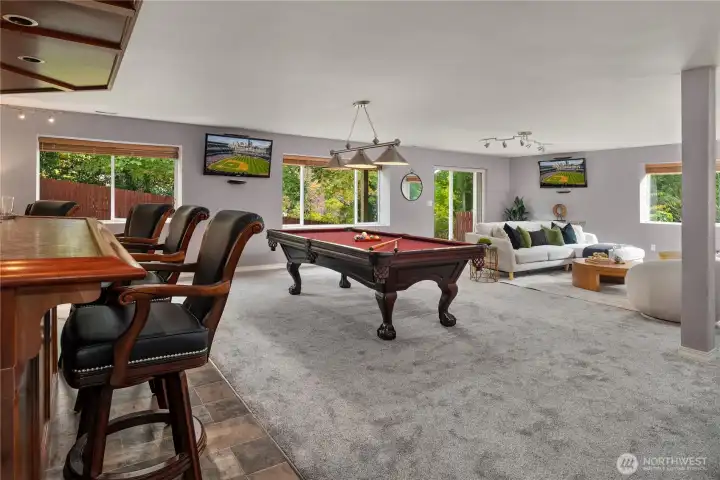 Downstairs is a daylight basement and a dream rec room that will rival some sports bars.