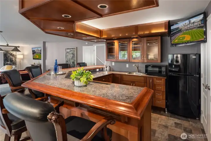 Recessed lights above the bar and underneath the counter as well as recessed lights in the soffit.