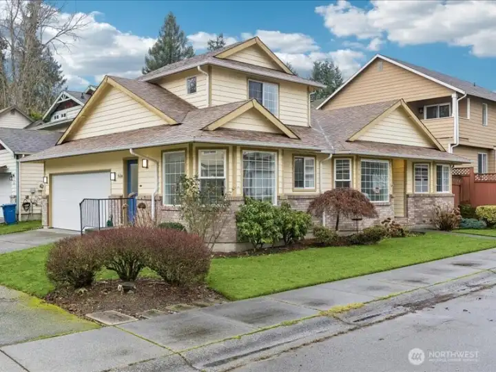 Large two car garage with driveway parking.