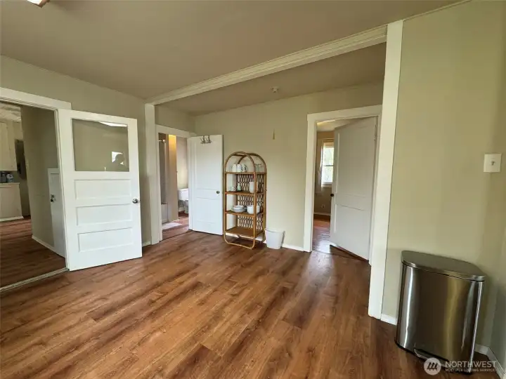 Kitchen looking towards a bedroom, bathroom and mud/laundry room