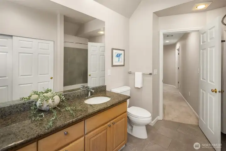 Upstairs hall bathroom with dual sinks, and a lovely shower over the bath tub
