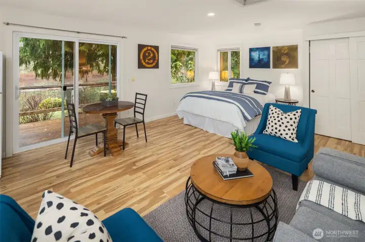 The cottage slider door leads out the deck area that overlooks the lake! This cottage has been freshly painted.