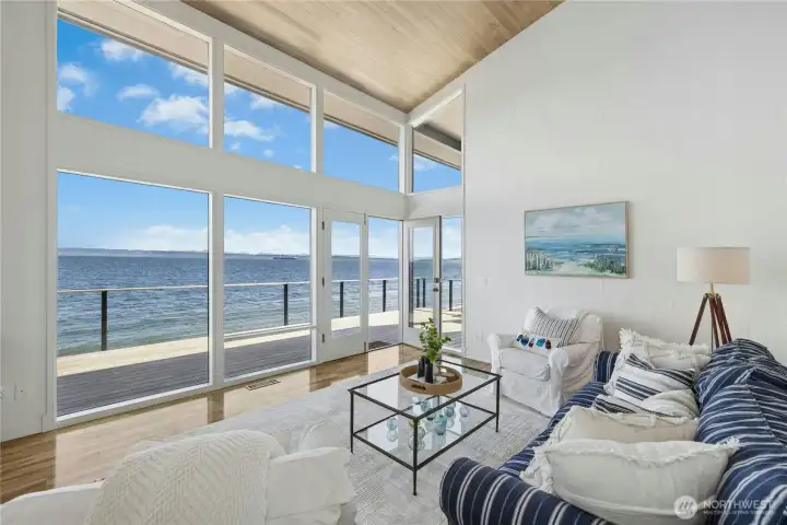 Main floor living room with floor to ceiling windows to capture the views.