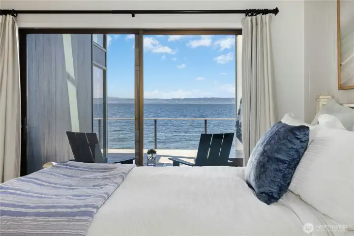 Primary Bedroom with slider out to covered deck to enjoy the views,