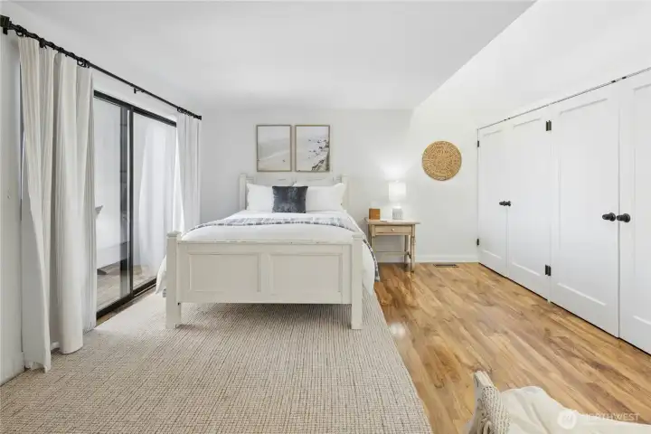 Primary bedroom is spacious with 3 full closets and open to above windows for light.