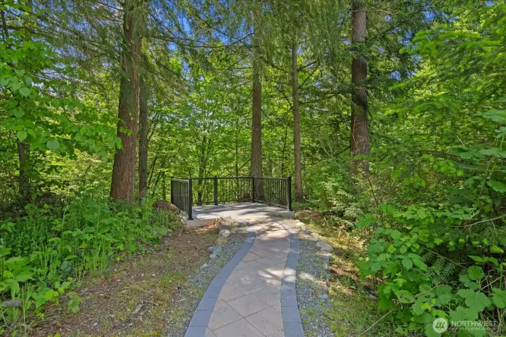 Brick pathway on the property leads to  serene overlook of the creek below.  Wonderful place to take in nature and  wildlife!