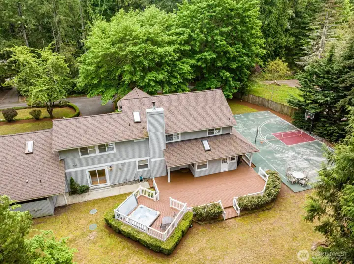If you love outdoor activities...this is the home.  3 bedrooms, 2.25 bathrooms, 2 dens (one upstairs one on the main), a bonus room, and outside features the hot tub, sport court, playhouse (or shed), woods to play in and more.