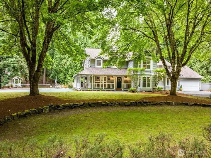 Parklike setting...home features a circle driveway...where lots of friends can park when they come to visit.