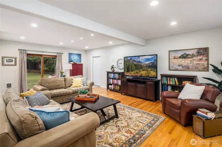 Family room with a slider to the deck and hottub.