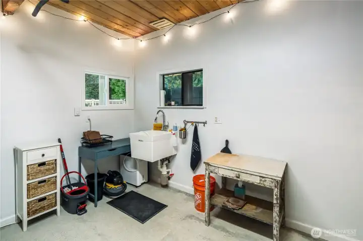 This is a heated shop or maker's space located off the back of the garage.