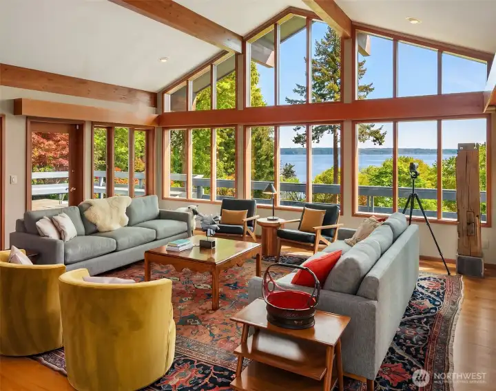 Vaulted wall of glass frame the view of Puget Sound views, filling the great room with light and effortless Northwest elegance