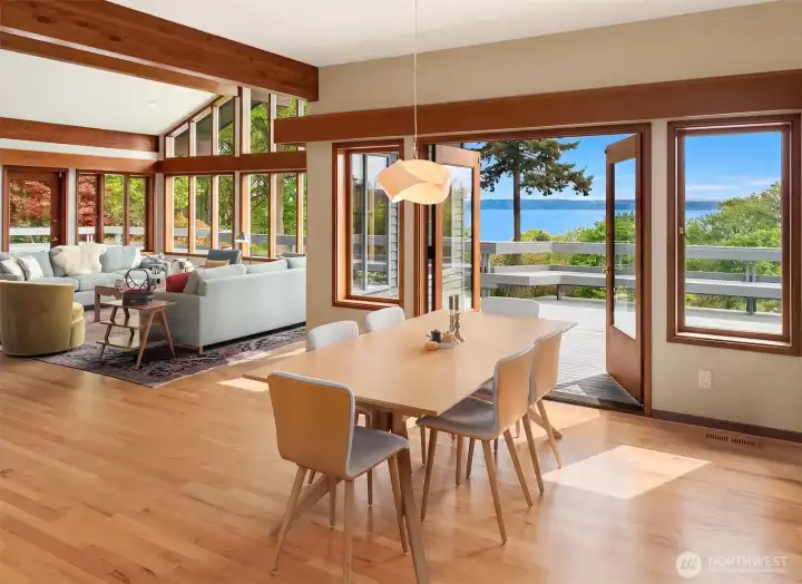 Light-filled dining opens to the deck for effortless entertaining framed by tranquil water views.