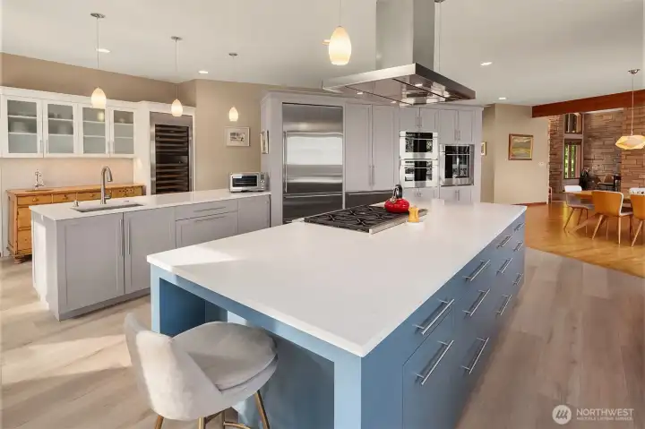 A true culinary centerpiece featuring Sub-Zero refrigeration, six-burner Wolf range, dual Fisher & Paykel dishwashers and wine storage. Double islands create exceptional workspace and casual seating.