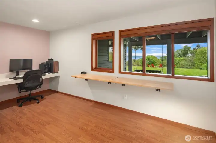 Light-filled third bedroom with walk-in closet and built-in desk space.